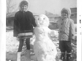 1968 May - Erin Klupper & Paul with snowman.jpg